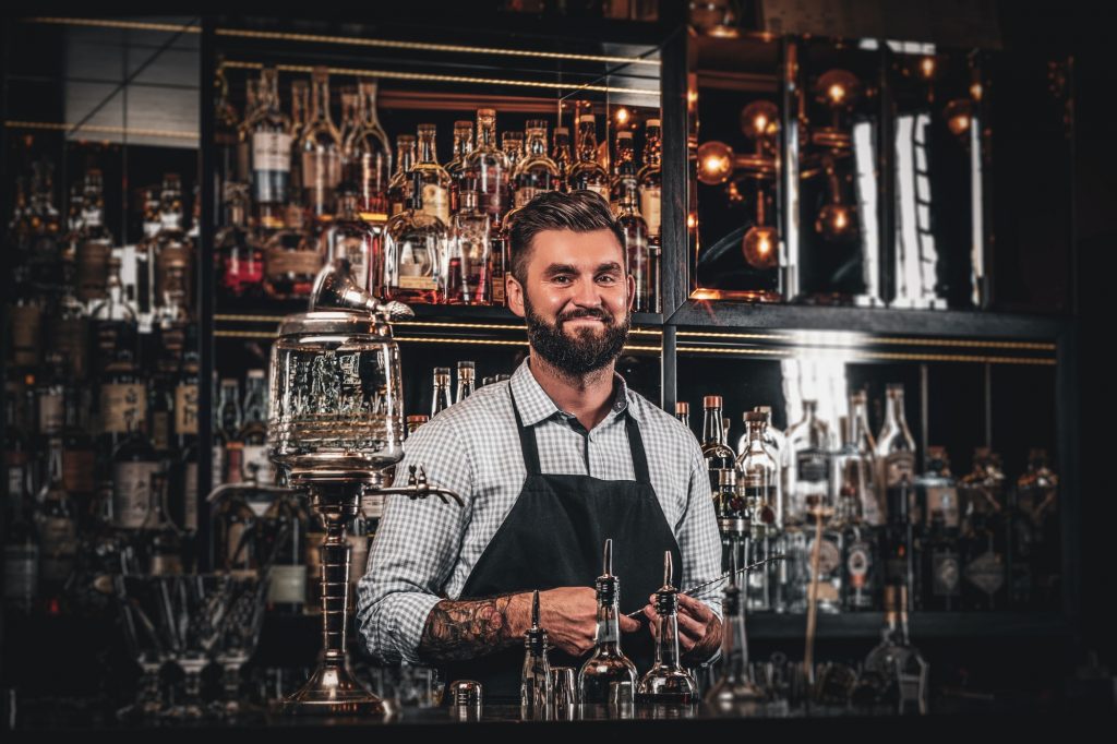 Handsome barman is posing for photographer